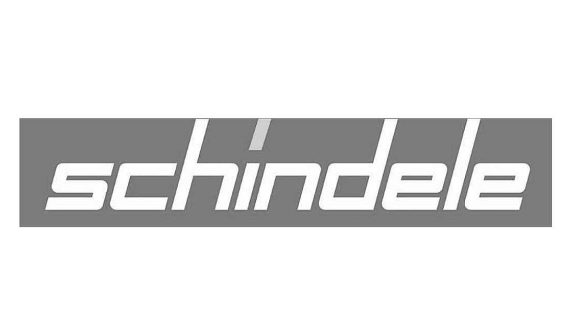 Schindele-Logo in weißer Schrift auf grauem Hintergrund.